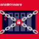 A decorative image showing a NAS device locked up with chains. The title reads NAS Ransomware.